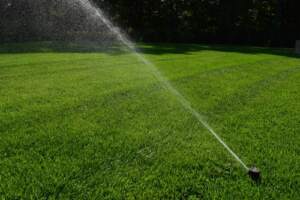 Garden Irrigation System Spraying Water on Grass