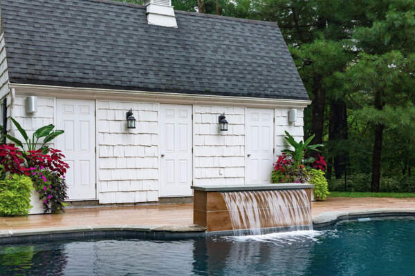 A stunning pool with a captivating water wall feature.