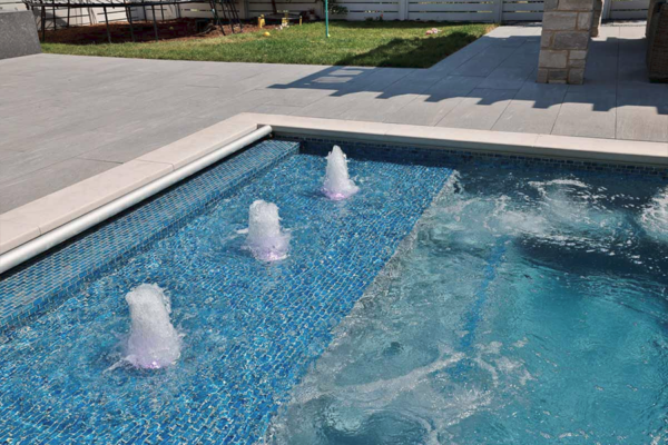 An innovative pool with mesmerizing bubblers as water features