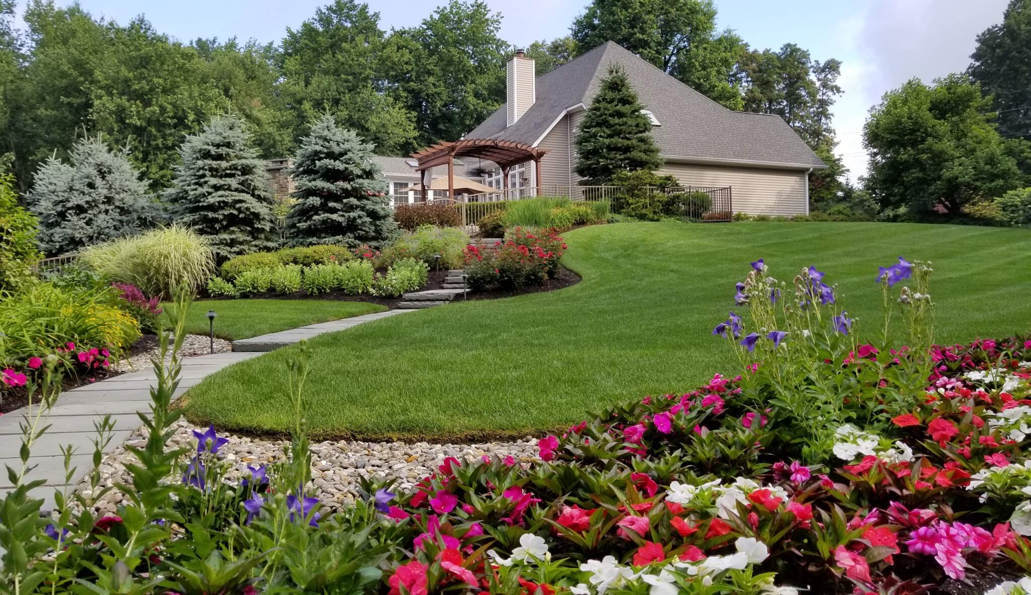 Fully insured local landscapers & contractors providing residential lawn care for a home 